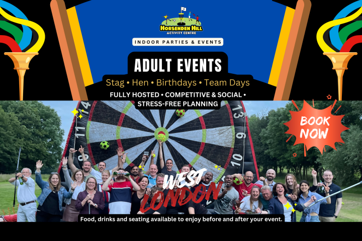 Group of people posing in front of a giant dartboard at an outdoor event organized by Horsenden Hill Activity Centre.